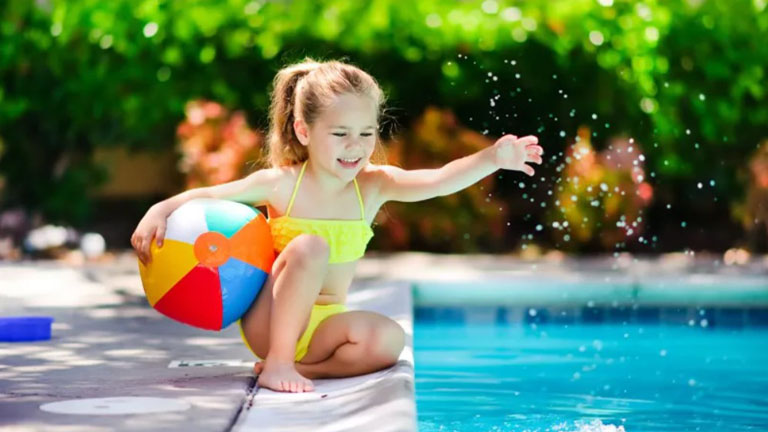Girl Playing beside the Pool