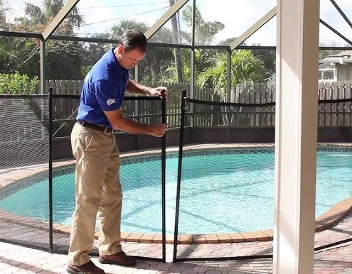 Pool Compliance Gold Coast inspector measuring glass fence