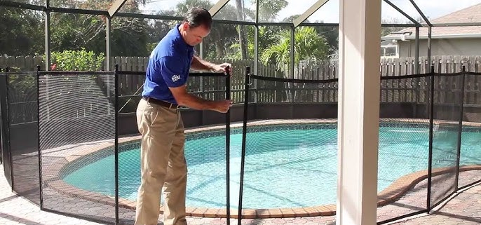 Pool Compliance Gold Coast inspector measuring glass fence